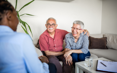 Elderly couple talking with a social worker