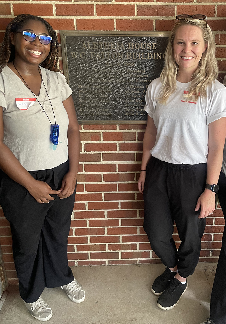 Danielle Jordan on left with representative of Alethia House on the right